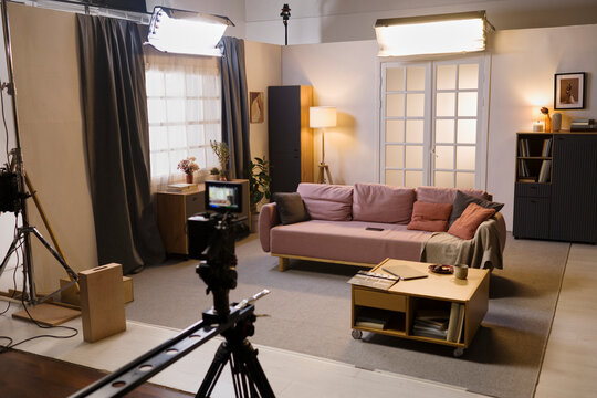 Empty living room film set with camera and lighting in studio
