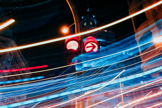 Traffic lights at luminous night in Madrid city, long exposure