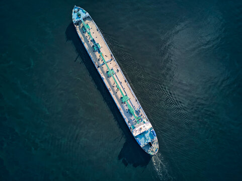 Aerial view of oil tanker moving on Volga River
