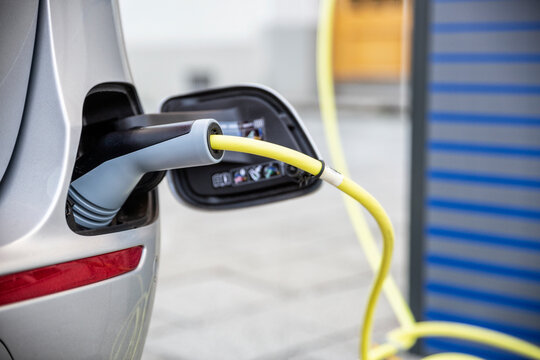 Electric car gettig charged at an charging station