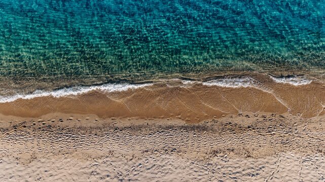 Aerial view of turquoise sea and sandy beach in Sardinia