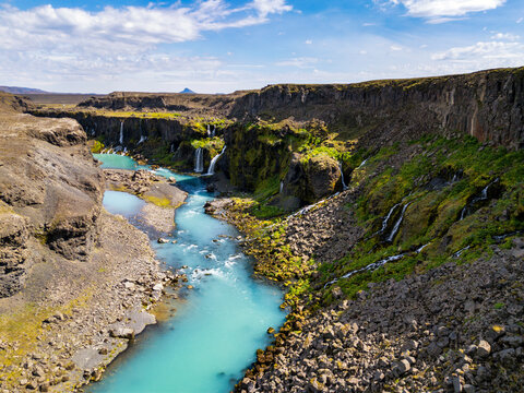 Turquoise river flows through Sigoldugljufur canyon in Iceland