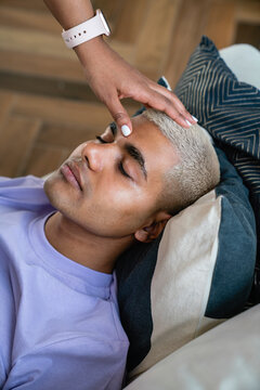 Hand of psychologist doing hypnosis therapy on patient