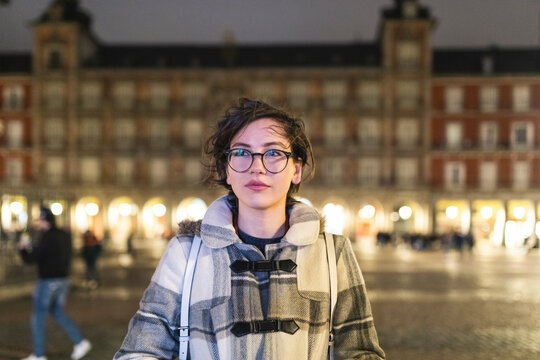 Spain, Madrid, portrait of young woman on Plaza Mayor