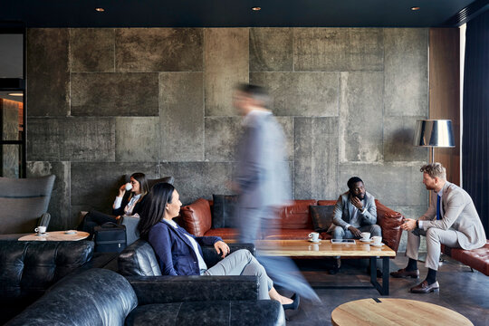 Business people having a meeting in hotel lobby