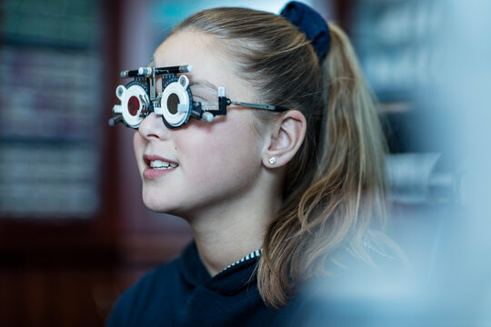Girl doing eye test at optometrist
