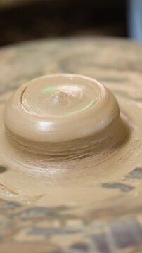 Close Up of Wet Clay Spinning on a Potters Wheel