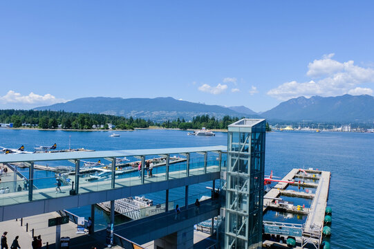 Float Planes Moored at Vancouver Harbour Flight Centre with Stanley Park and North Shore Mountains in Vancouver, Canada