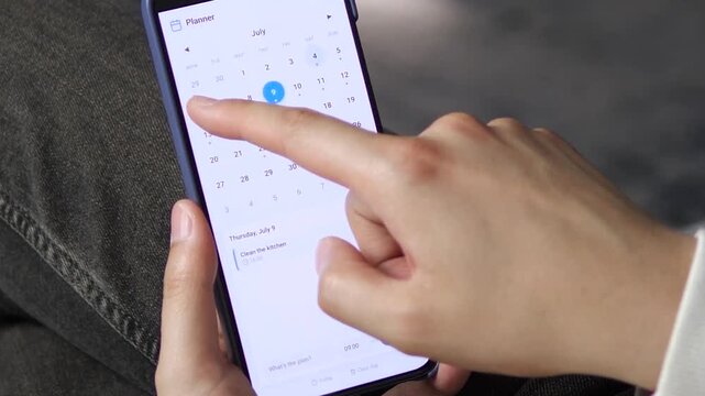 Mobile planner app for daily task management. User taps a July date, reviews a Call mom reminder, and switches to another day. Perfect for productivity software