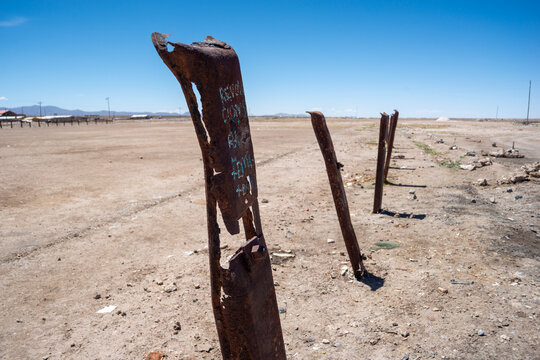 rusty border fence in desert