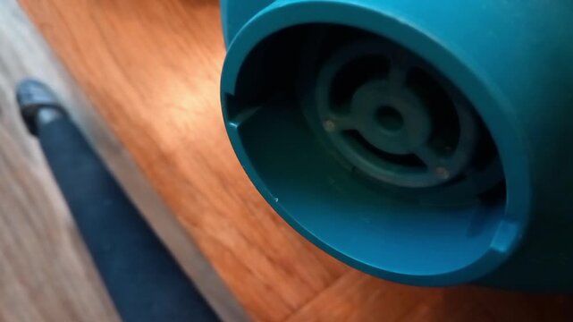 Close up of leaf blower motor showing air intake with sound of roaring power from maximum to off