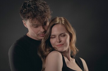 Happy couple sharing an intimate moment of love and tenderness in a studio