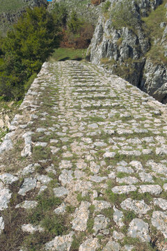 old stone road surface with grass of the bridge "Ovciji Brod", Bratac, Nevesinje, Bosnia and Herzegovina