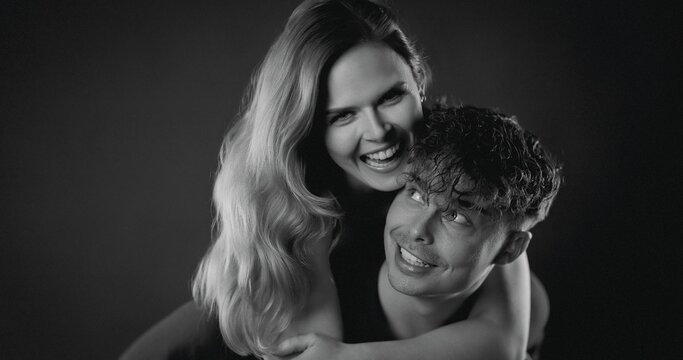 Loving couple laughing and smiling during playful portrait session