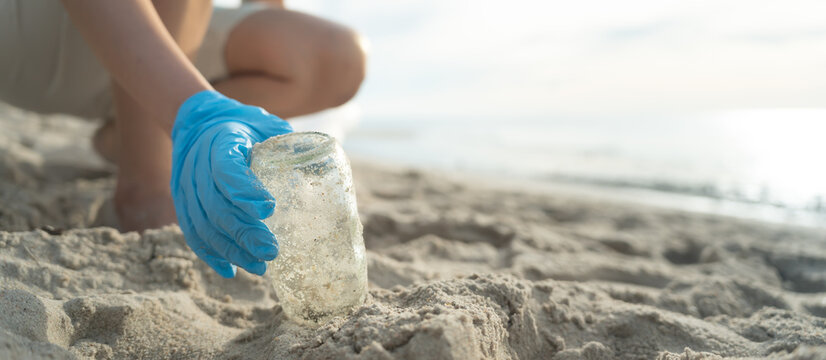 Save water. Volunteer pick up trash garbage at the beach and plastic bottles are difficult decompose prevent harm aquatic life. Earth, Environment, Greening planet, reduce global warming, Save world