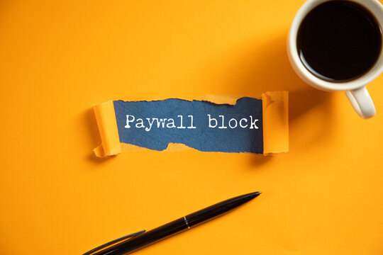 Paywall block text printed on  ripped paper