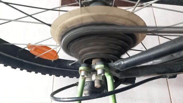 Bicycle cassette accelerates to high RPM with sudden chain clatter in close up view