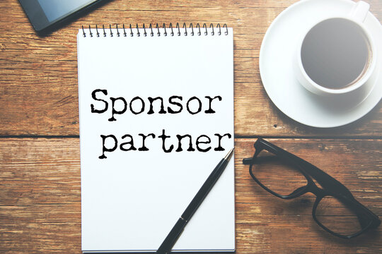 white paper sign with sponsor partner message