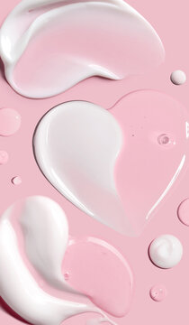 creamy texture of cosmetic samples on a pastel pink background