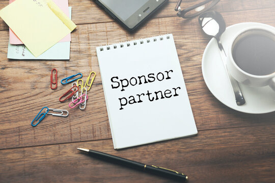 white paper sign with sponsor partner message
