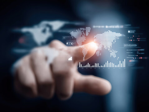 Businessman touching a digital world map with global network connections and financial data charts