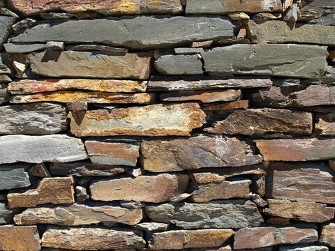 Dry stack stone wall masonry texture background