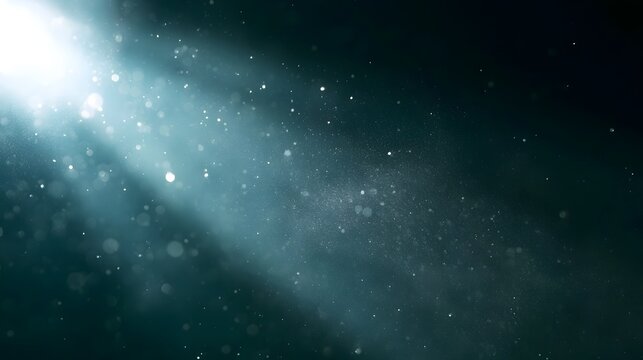 A radiant beam of light illuminates suspended particles against a dark background  creating an ethereal and serene atmosphere