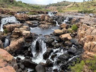 Waterfalls cascade over rocky terrain at Bourke's Luck Potholes near Graskop, Mpumalanga, South Africa © Pavel Jiranek