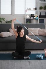 Fototapeta premium asian woman attractive exercises workout at home