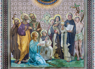 Fototapeta premium Monza - The detail from fresco of Adoration of Lamb of God in the church Chiesa di San Carlo by Grandi from year 1925.