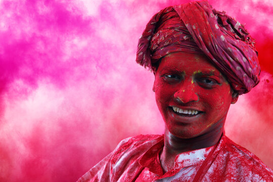 Portrait of Indian man playing holi