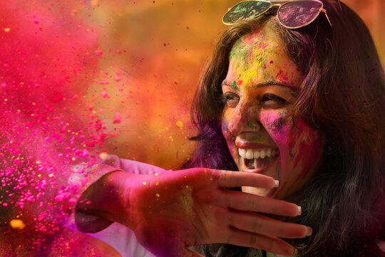A Young Indian girl celebrating Holi festival
