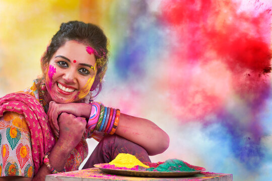 Portrait of  young Indian Woman celebrating Holi color festival