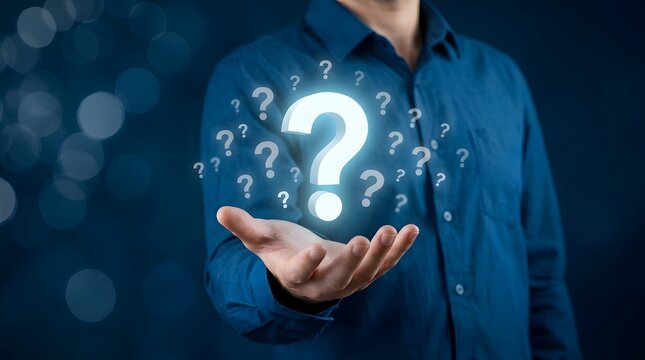A businessman holding a glowing digital question mark icon in his hand representing business problem solving and decision making concepts