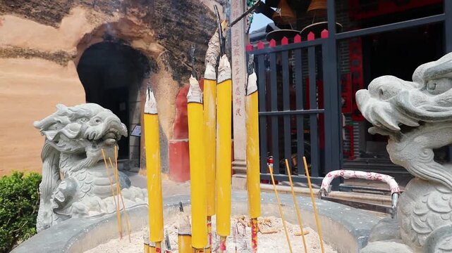 Burning insence sticks at Na Tcha Temple in Macau
