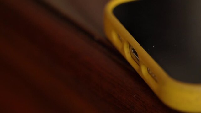 Hand unplugging the charger from cell phone