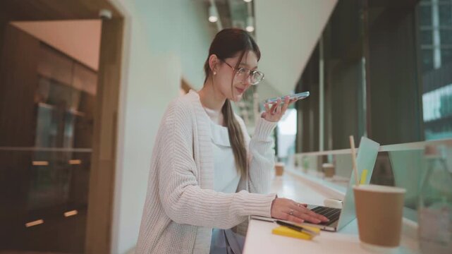 Businesswoman consultant with client talking on smartphone professional work asian business woman finance career confidence work