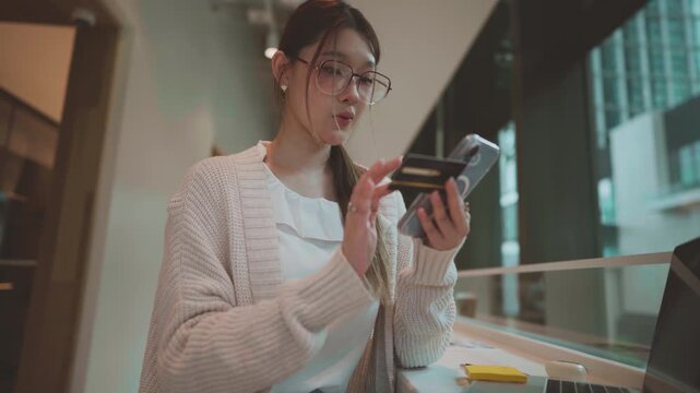 Young adult business asian woman using credit card shopping online or banking payment, digital wallet paying
