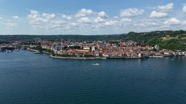 Aerial Pullback Arona Town on Italian Lake Maggiore on a Sunny Day