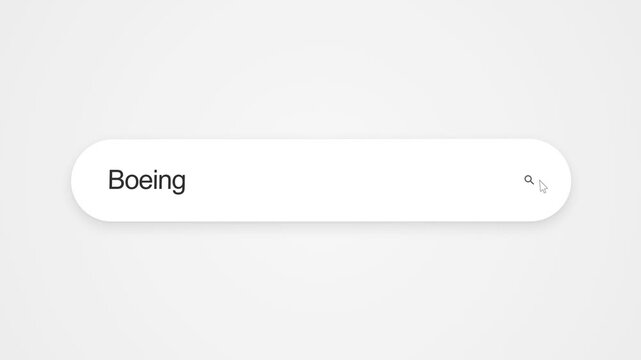 User Typing The Word Boeing Into A Web Browser Search Bar On A Computer Screen - Close Up