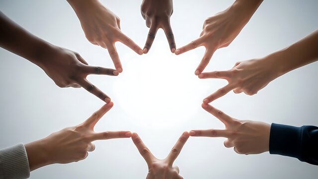 Diverse people joining fingers to form a star shape, representing unity, teamwork, cooperation, diversity, and togetherness