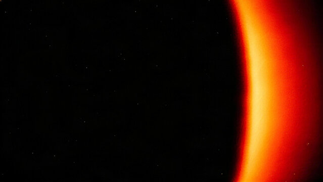Intense orange arc film burn and edge light leak overlay on black background