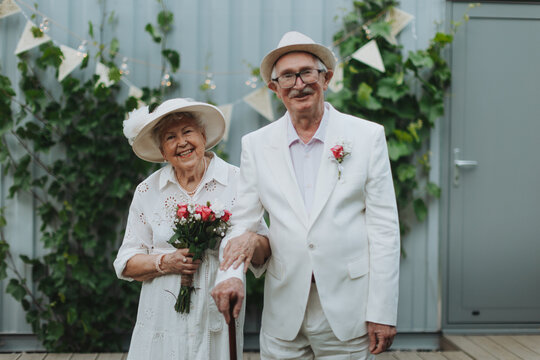 Senior couple having marriage in garden, during summer day.
