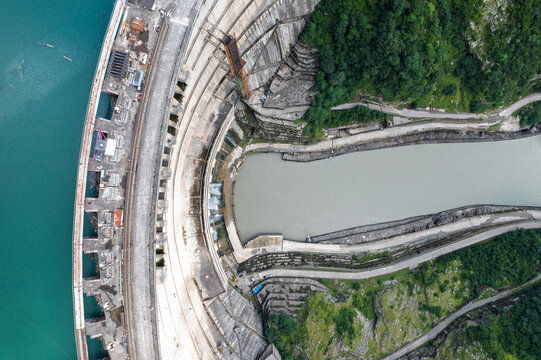 Enguri arch dam aerial panorama with turquoise reservoir and massive hydropower infrastructure for renewable energy, water security, engineering and Georgia travel.
