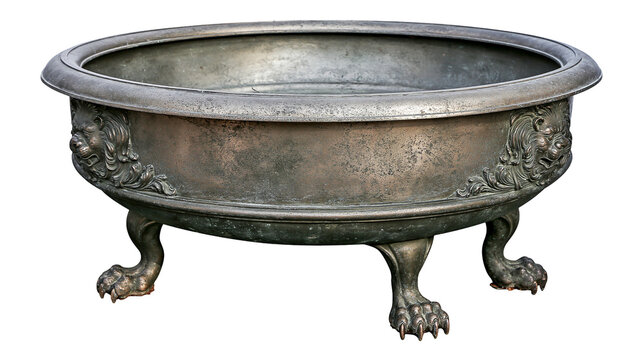 Antique pewter basin with lion head decorations and claw feet, isolated on transparent background