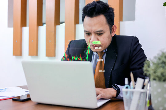 Senior Professional Typing On Laptop While Analyzing Holographic Stock Market Charts In Office Room