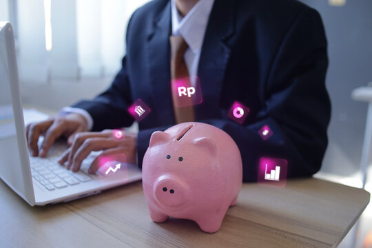 Piggy Bank Near Employer Investor Typing On Laptop Managing Savings And Digital Investment Assets