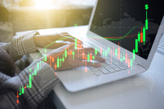 Hand Typing on Laptop to Analyze Financial Growth Hologram at Work Desk