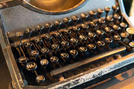 Close-up of vintage typewriter keys with letters and numbers