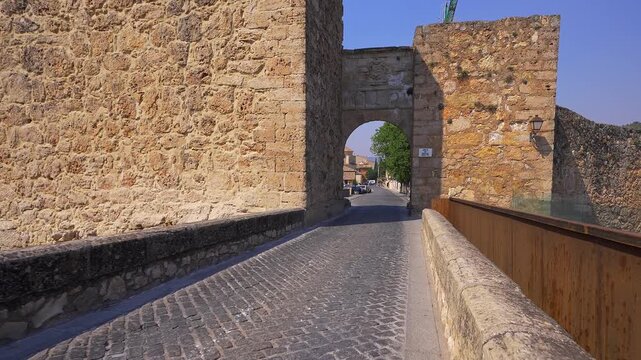 Cobblestone bridge leading through Arco de Bezudo at Cuenca Castle in Cuenca Spain
